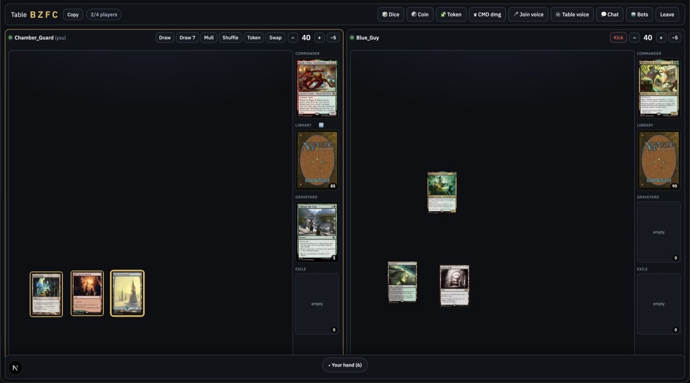Two-player playtable with shared life totals, commanders, libraries, and cards on both boards